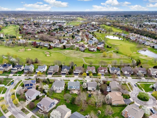 birds eye view of property with a residential view, a water view, and golf course view