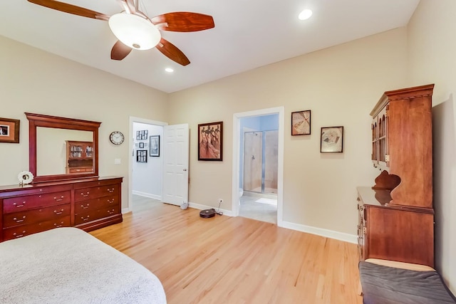 bedroom featuring light wood-style flooring, ensuite bath, baseboards, and recessed lighting