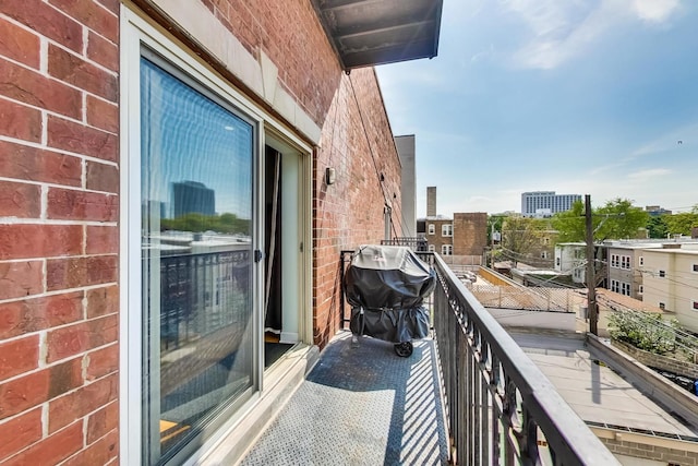 balcony with a grill and a city view