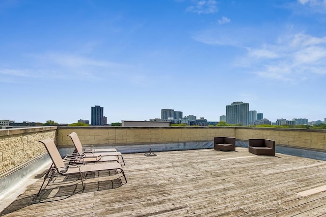 wooden deck with a city view