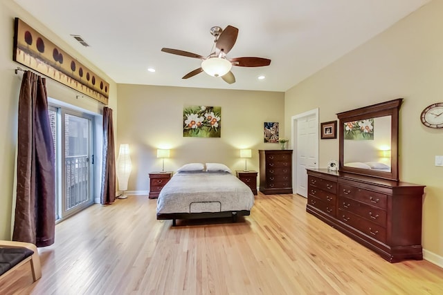 bedroom featuring visible vents, baseboards, light wood-style floors, and access to exterior