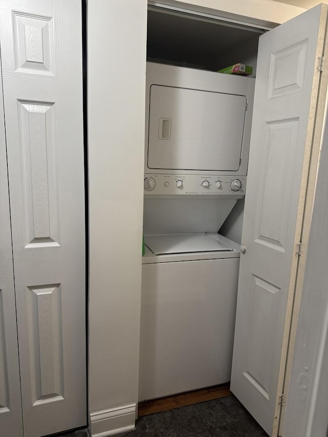 laundry room with laundry area and stacked washing maching and dryer