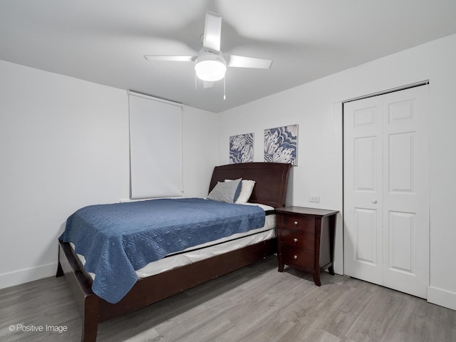 1812 W Erie St, Chicago, IL 60622 - bedroom with light wood-style floors, a closet, ceiling fan, and baseboards