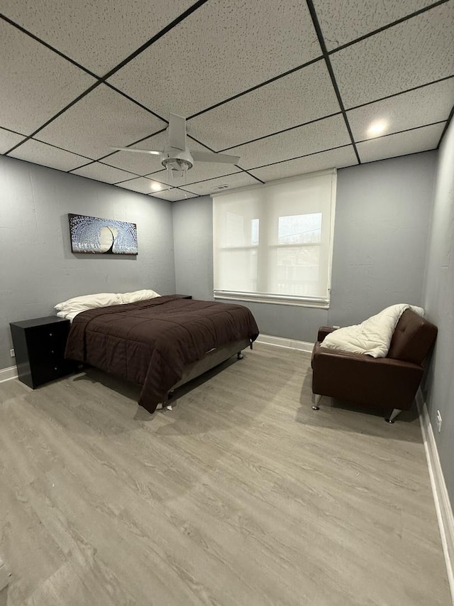 1812 W Erie St, Chicago, IL 60622 - bedroom with baseboards, a drop ceiling, and wood finished floors