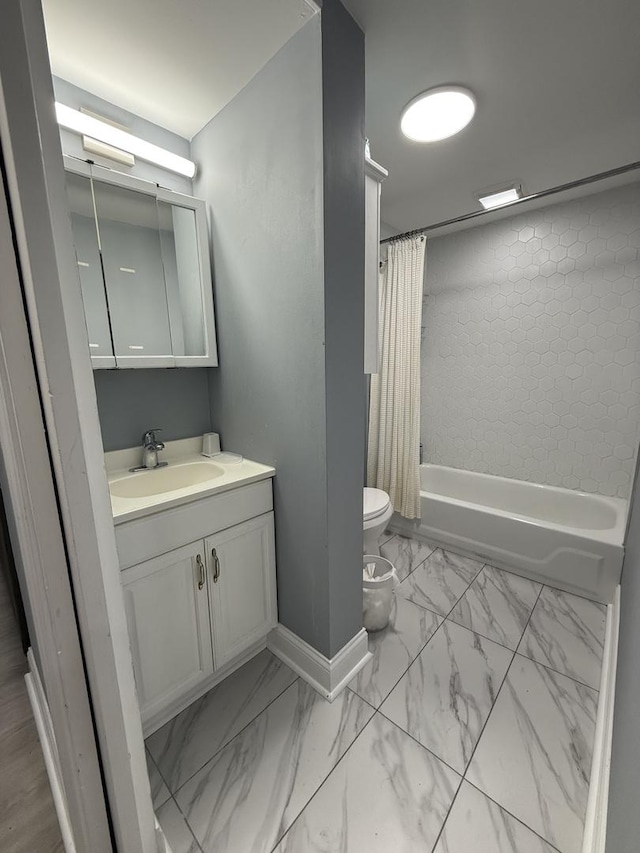 1812 W Erie St, Chicago, IL 60622 - full bathroom with shower / bath combo with shower curtain, vanity, marble finish floor, and toilet
