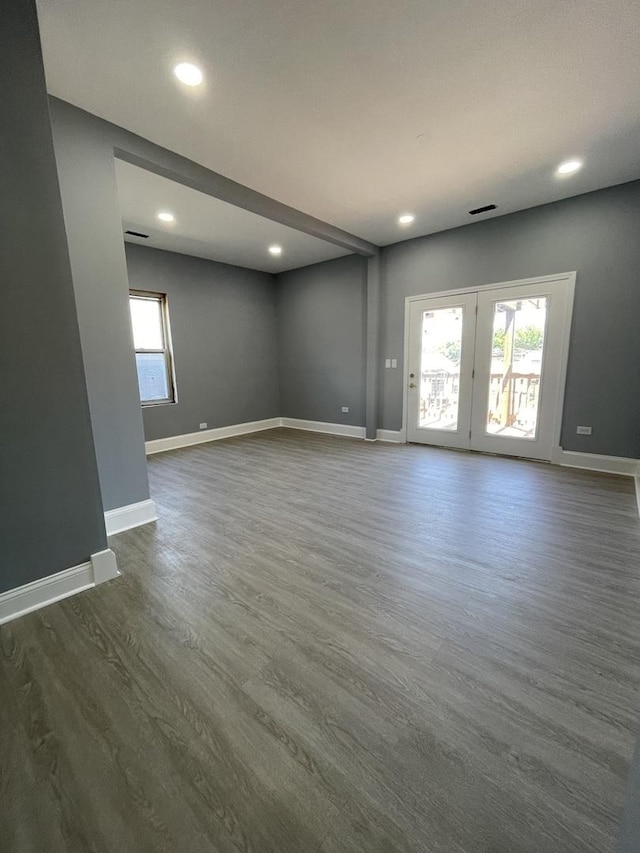 1812 W Erie St, Chicago, IL 60622 - unfurnished room with dark wood-type flooring, baseboards, recessed lighting, and a healthy amount of sunlight