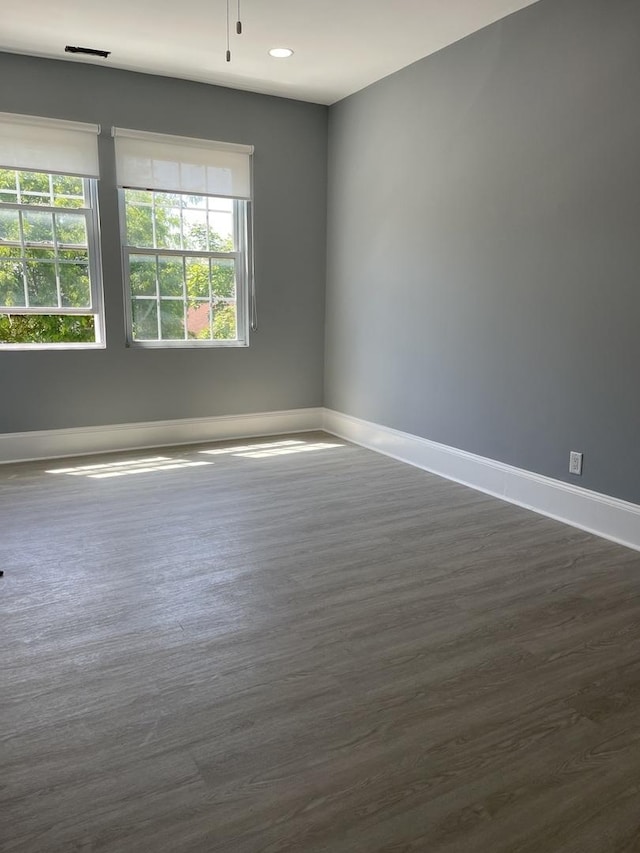 1812 W Erie St, Chicago, IL 60622 - unfurnished room featuring recessed lighting, dark wood-type flooring, visible vents, and baseboards