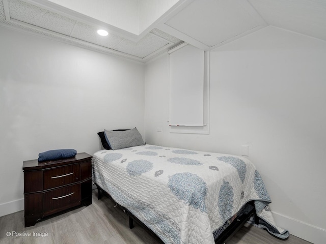 1812 W Erie St, Chicago, IL 60622 - bedroom with wood finished floors, baseboards, and vaulted ceiling