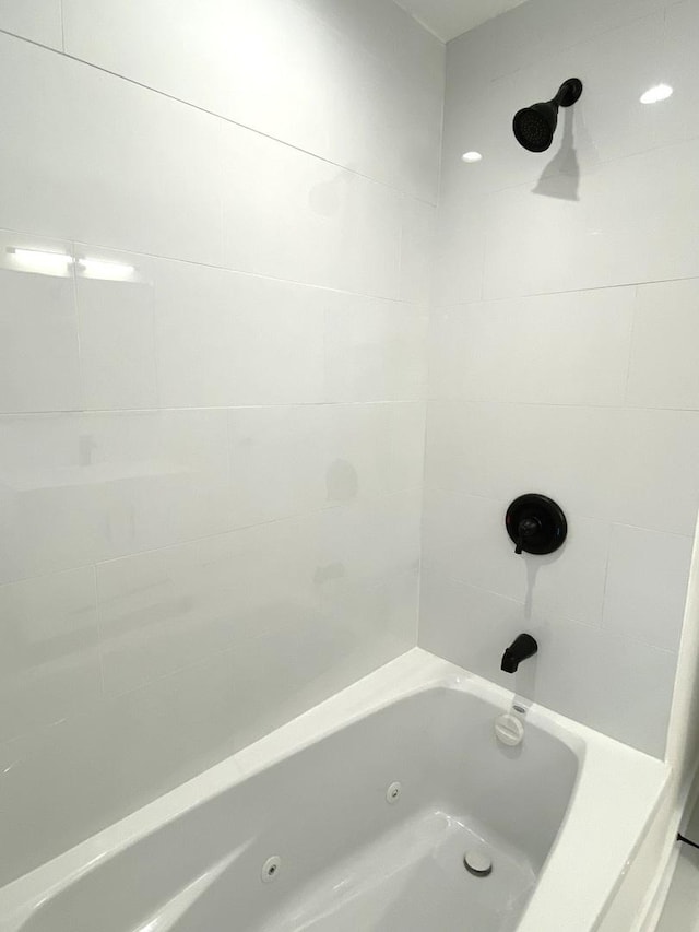 bathroom featuring a combined bath / shower with jetted tub