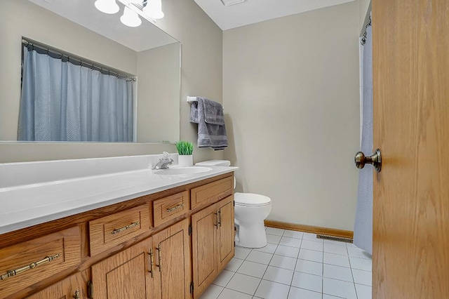 18148 Vermont Ct Unit 243, Orland Park, IL 60467 - bathroom featuring toilet, vanity, tile patterned floors, and baseboards
