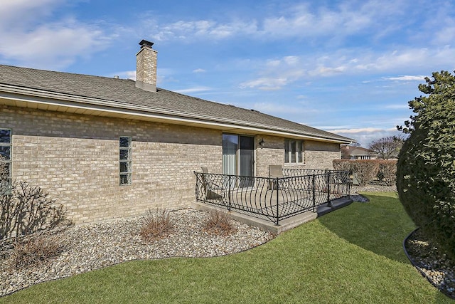 18148 Vermont Ct Unit 243, Orland Park, IL 60467 - rear view of house with brick siding, a chimney, and roof with shingles