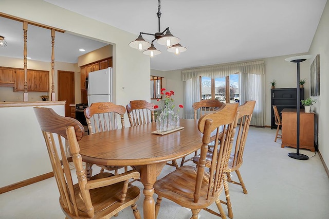 18148 Vermont Ct Unit 243, Orland Park, IL 60467 - dining room with a chandelier, baseboards, and light colored carpet