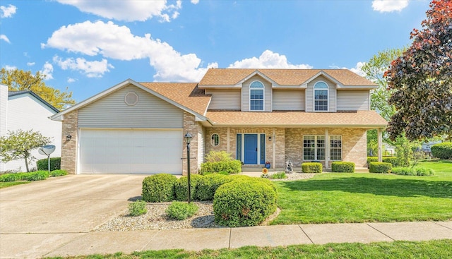 1310 Kimela Dr, Mahomet, IL 61853 - traditional-style house with an attached garage, a shingled roof, a front yard, driveway, and brick siding
