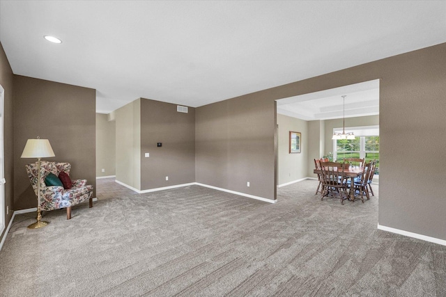 1310 Kimela Dr, Mahomet, IL 61853 - sitting room with carpet floors, baseboards, a chandelier, and recessed lighting