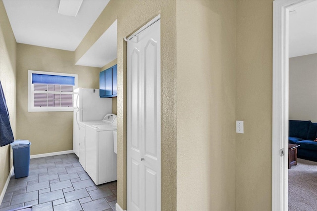 1310 Kimela Dr, Mahomet, IL 61853 - washroom featuring washing machine and clothes dryer, cabinet space, baseboards, and a textured wall