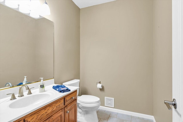 1310 Kimela Dr, Mahomet, IL 61853 - bathroom featuring baseboards, toilet, and vanity