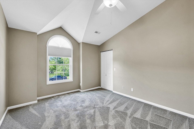 1310 Kimela Dr, Mahomet, IL 61853 - unfurnished room featuring carpet floors, lofted ceiling, ceiling fan, and baseboards