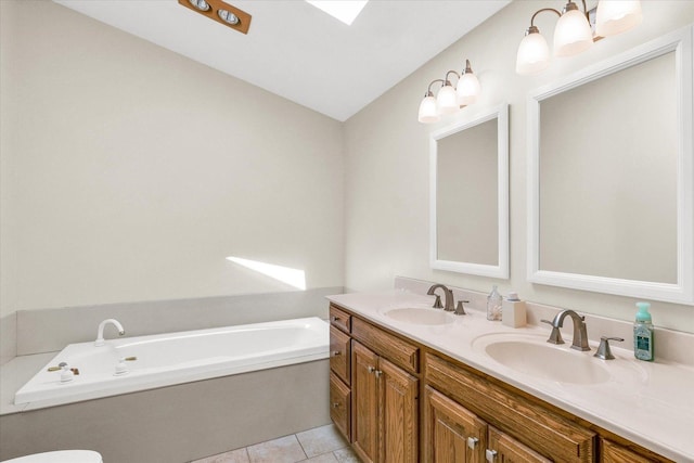 1310 Kimela Dr, Mahomet, IL 61853 - bathroom with a bath, double vanity, tile patterned floors, and vaulted ceiling