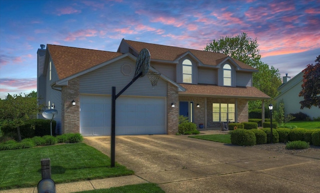 1310 Kimela Dr, Mahomet, IL 61853 - traditional-style house with concrete driveway, a garage, a lawn, brick siding, and a chimney