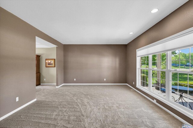1310 Kimela Dr, Mahomet, IL 61853 - carpeted spare room with baseboards and recessed lighting