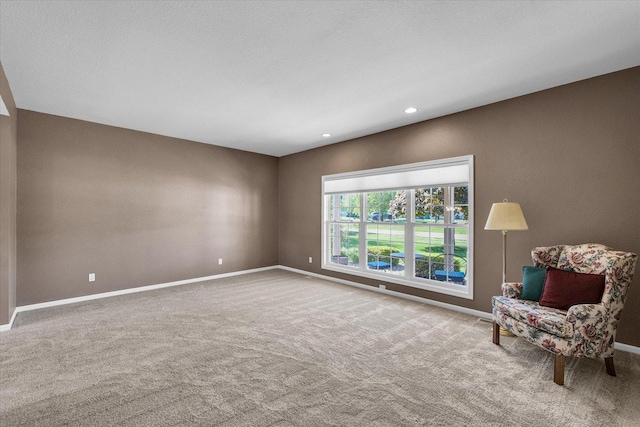 1310 Kimela Dr, Mahomet, IL 61853 - living area featuring baseboards, carpet floors, and recessed lighting