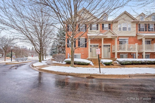 view of property with brick siding