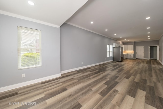 2017 W 68th St, Chicago, IL 60636 - unfurnished living room featuring crown molding, baseboards, recessed lighting, and dark wood finished floors