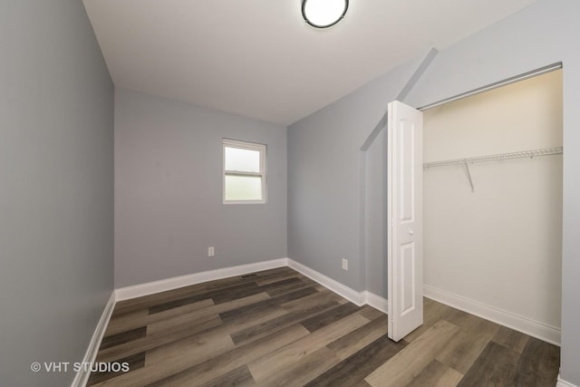 2017 W 68th St, Chicago, IL 60636 - unfurnished bedroom featuring dark wood-style floors, baseboards, and a closet