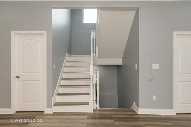 2017 W 68th St, Chicago, IL 60636 - staircase featuring wood finished floors and baseboards