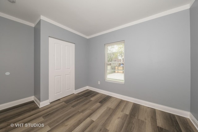 2017 W 68th St, Chicago, IL 60636 - unfurnished room with dark wood finished floors, baseboards, and crown molding