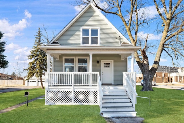 bungalow-style home featuring a porch and a front yard