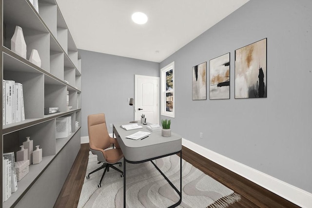 office area featuring baseboards and dark wood finished floors