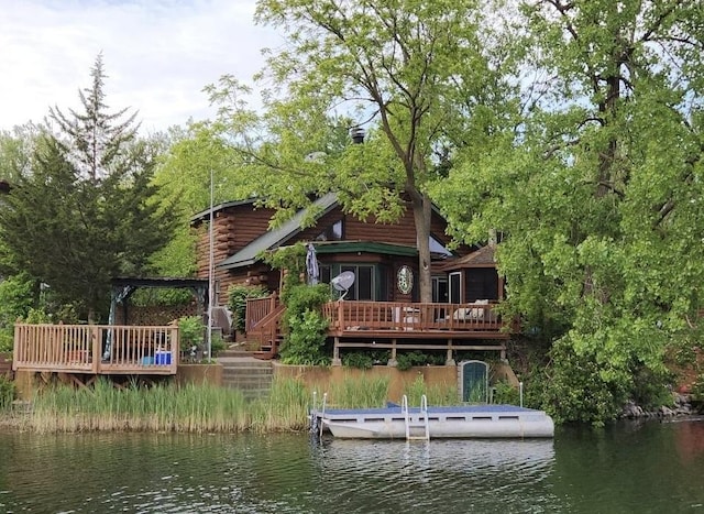 64 Big Musky Circle Ln, Wilmington, IL 60481 - back of property with log siding and a deck with water view