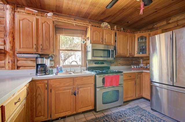 64 Big Musky Circle Ln, Wilmington, IL 60481 - kitchen featuring appliances with stainless steel finishes, a sink, light tile patterned floors, light countertops, and wood ceiling