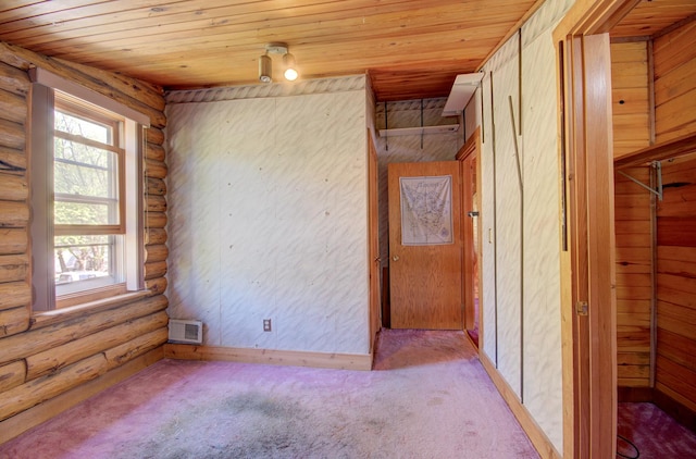 64 Big Musky Circle Ln, Wilmington, IL 60481 - empty room featuring log walls, carpet flooring, and wooden ceiling