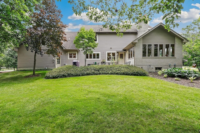 3048 Brampton Ln, Dyer, IN 46311 - rear view of house with a lawn and roof with shingles