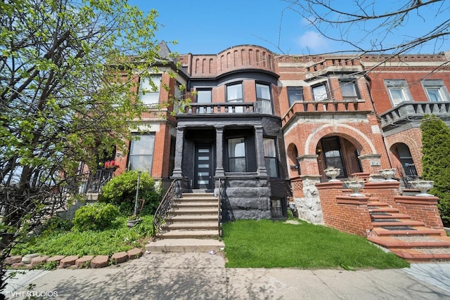 view of front of house with brick siding