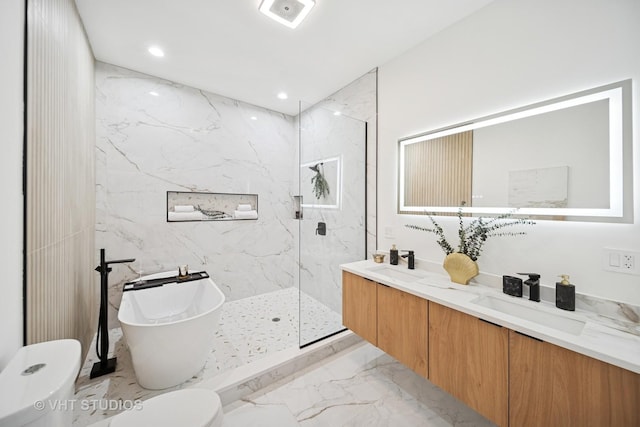 full bathroom featuring a sink, a soaking tub, toilet, and marble finish floor