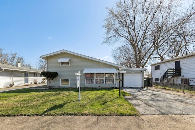 16641 Honore Ave, Markham, IL 60428 - traditional home with a front yard, fence, and driveway