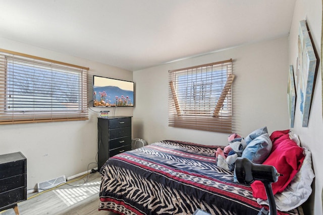 16641 Honore Ave, Markham, IL 60428 - bedroom with visible vents, baseboards, and wood finished floors