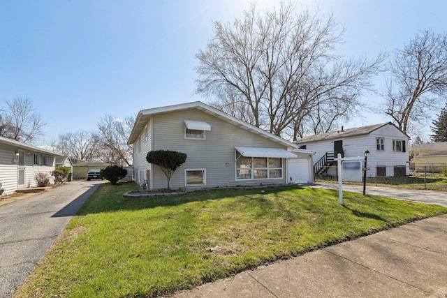 16641 Honore Ave, Markham, IL 60428 - bungalow-style home with a garage, driveway, and a front lawn