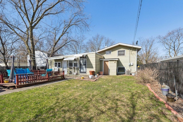 16641 Honore Ave, Markham, IL 60428 - rear view of house featuring a yard, a fenced backyard, a wooden deck, and central AC