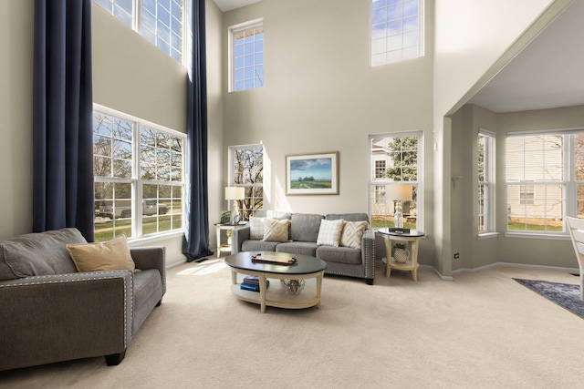 living room with carpet and baseboards