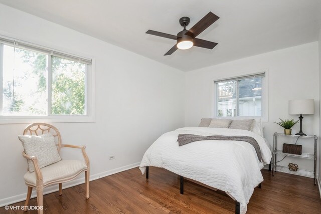 318 N Oaklawn Ave, Elmhurst, IL 60126 - bedroom featuring multiple windows, wood finished floors, baseboards, and ceiling fan
