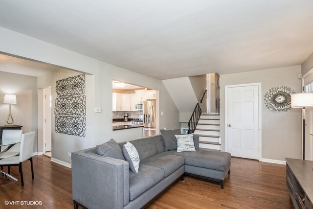 318 N Oaklawn Ave, Elmhurst, IL 60126 - living room featuring dark wood-type flooring, stairs, and baseboards