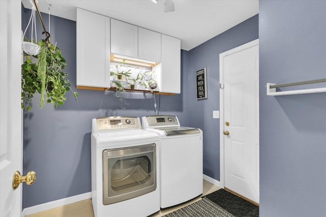 2203 E Pennsylvania Ave, Urbana, IL 61802 - laundry room with washing machine and clothes dryer, baseboards, and cabinet space