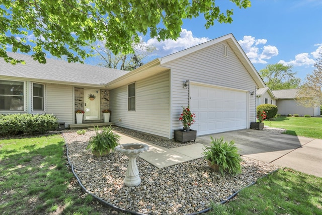 2203 E Pennsylvania Ave, Urbana, IL 61802 - single story home with a garage, concrete driveway, and a front yard