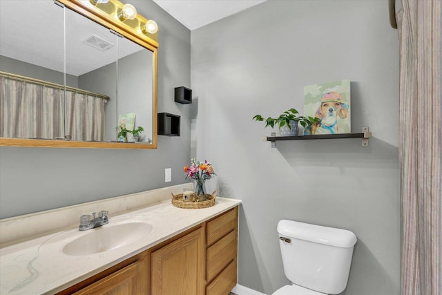 2203 E Pennsylvania Ave, Urbana, IL 61802 - bathroom with vanity, toilet, and curtained shower