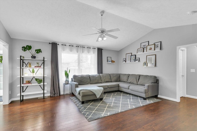 2203 E Pennsylvania Ave, Urbana, IL 61802 - living room featuring ceiling fan, hardwood / wood-style floors, vaulted ceiling, a textured ceiling, and baseboards