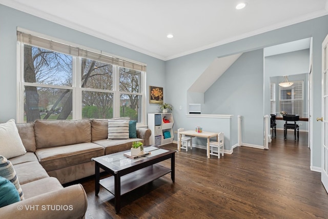 living room with baseboards, ornamental molding, recessed lighting, and wood finished floors